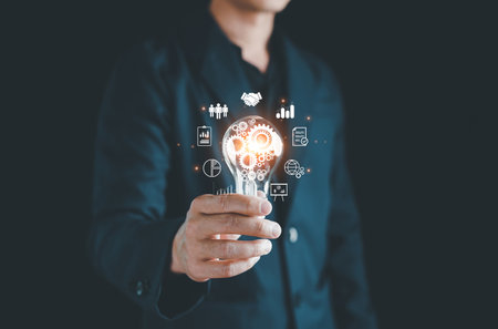 Hand holding Light bulb, Technology solution, Digital link tech, Global Internet connection cloud computing. Digital marketing, Global business internet connection, Financial and banking, big data.の写真素材