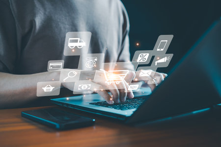 A shopper uses a laptop to place an order, complete a transaction, and explore innovations in e-commerce. The process involves customers, buyers, sales, and payment through credit cards, with delivery by truck for online shopping.の写真素材
