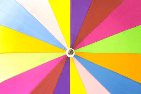 A cloth  multicolored umbrella, background.