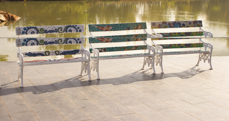 White chairs in the garden, swimming pool.の写真素材