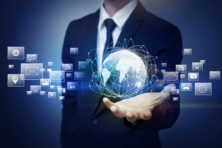 Close up of businessman holding global connectionの写真素材