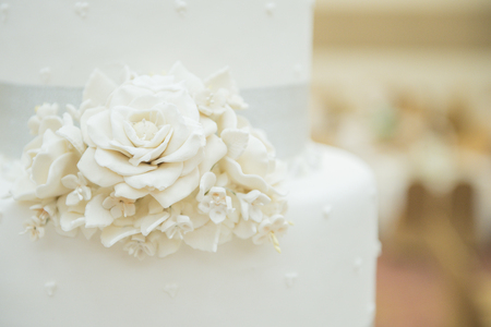 White wedding cake with flowerの写真素材