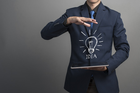 close up of businessman with idea iconの写真素材