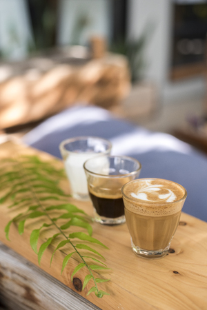 The ingredients of coffee on a wooden deskの写真素材