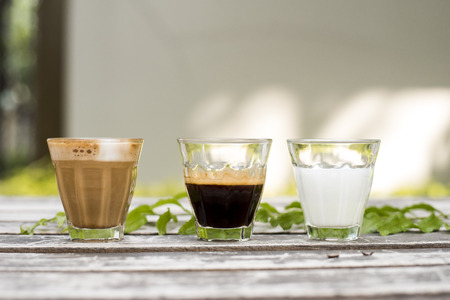 The ingredients of coffee on a wooden deskの写真素材