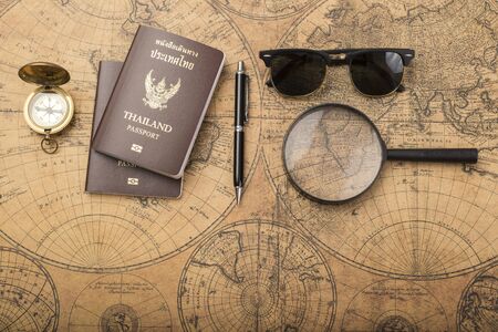 Planning travel concept, Thailand passport on old mapの写真素材