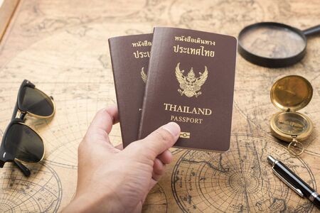 Planning travel concept, Thailand passport on old mapの写真素材