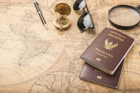 Planning travel concept, Thailand passport on old map