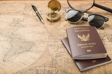 Planning travel concept, Thailand passport on old mapの写真素材