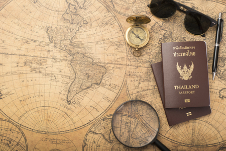 Planning travel concept, Thailand passport on old mapの写真素材