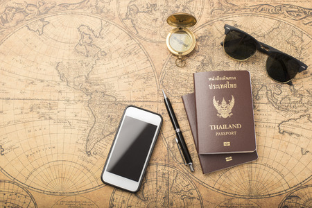 Planning travel concept, Thailand passport on old mapの写真素材
