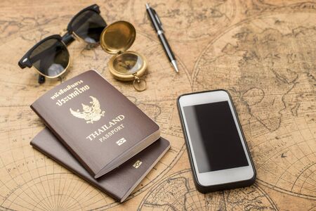 Planning travel concept, Thailand passport on old mapの写真素材