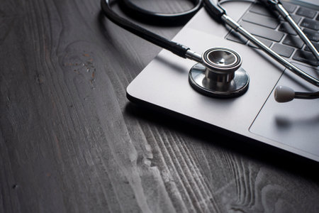 Close-up Of Medical Stethoscope On Laptop Keyboardの写真素材