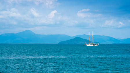 Beautiful sea view with boat against blue skyの写真素材
