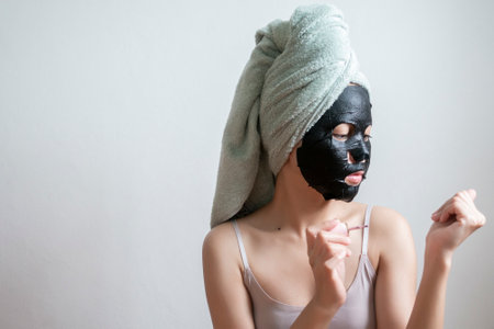 Beautiful woman with Black  facial mask, Lifestyle conceptの写真素材