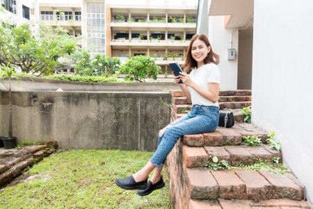University student is holding tabletの写真素材