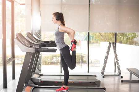 Pretty young sporty woman is warm up in gym, Healthy lifestyle