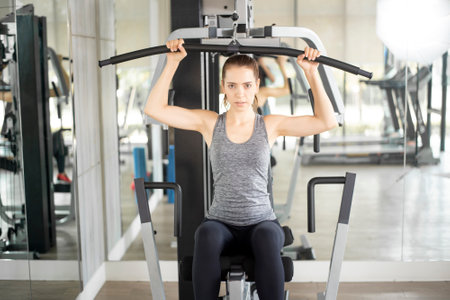 Pretty young sport woman is Workout in gym, Healthy lifestyle