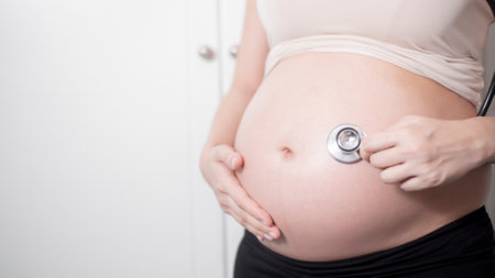 Beautiful asian pregnant woman expecting  baby with stethoscope