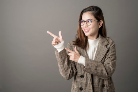 Portrait of Attractive business woman in studio grey backgroundの写真素材