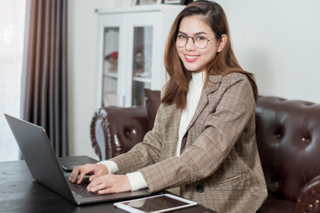 Business woman is working in her office deskの写真素材