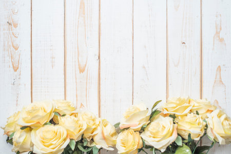 Top view of wedding flowers on white wood backgroundの写真素材