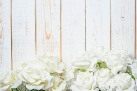 Top view of wedding flowers on white wood backgroundの写真素材