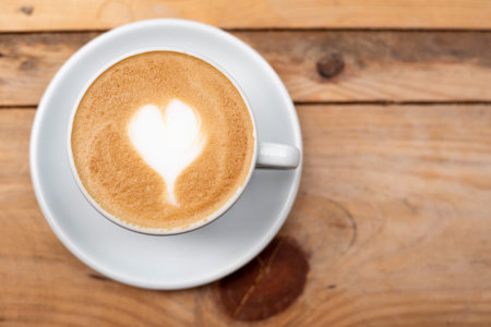 latte art heart on wood table