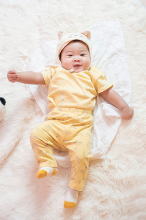 Happy newborn cute baby in studioの写真素材