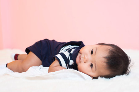 Happy newborn cute baby in studioの写真素材