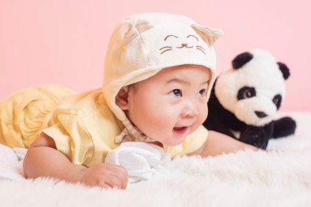 Happy newborn cute baby in studioの写真素材
