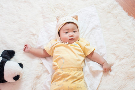 Happy newborn cute baby in studioの写真素材