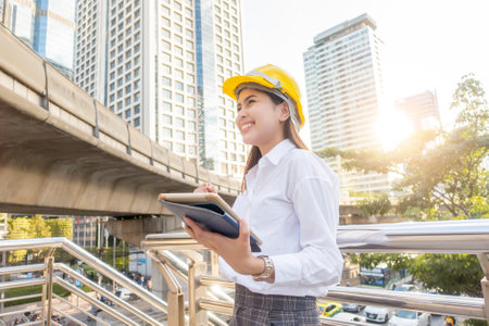 Engineering woman  is working in outdoor city backgroundの写真素材