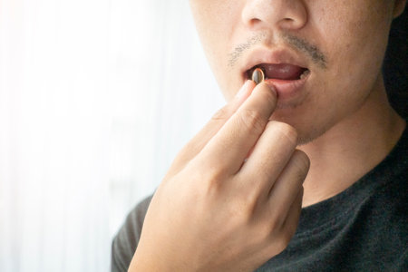 Close up hand is holding vitamins pillsの写真素材