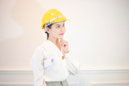 Engineer woman is smiling on white backgroundの写真素材