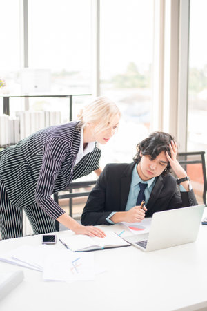 Business people are analyzing financial reportの写真素材