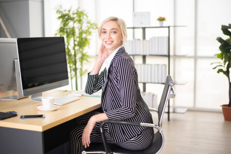 Beautiful smart Caucasian business woman in officeの写真素材