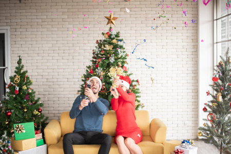 Attractive Caucasian couple of love are  celebrating Christmas in homeの写真素材