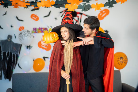 happy couple of love  in costumes and makeup on a celebration of Halloweenの写真素材