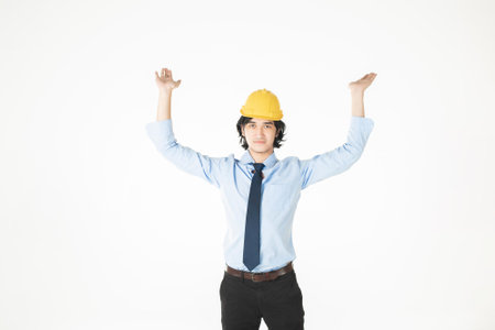 engineering Man wearing yellow helmet on whiteの写真素材