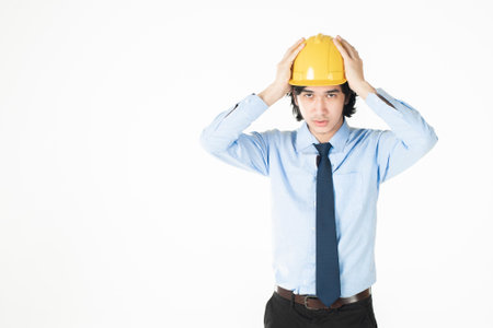 engineering Man wearing yellow helmet on whiteの写真素材