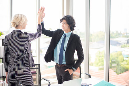 Business people are happy with business success in officeの写真素材