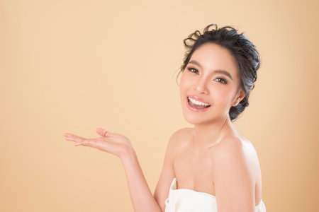 Beautiful perfect skin gorgeous young woman portrait in studioの写真素材