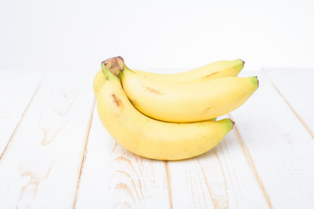 banana on white wooden backgroundの写真素材