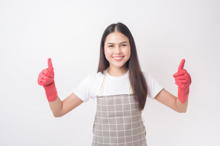 Beautiful woman housekeeper portrait on white backgroundの写真素材