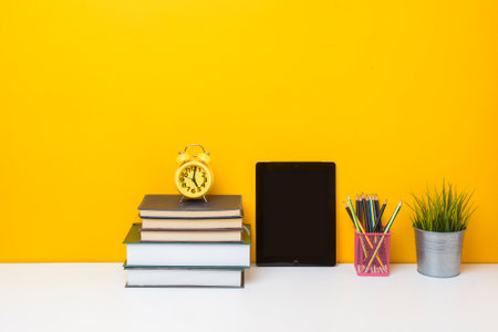 School equipment on yellow background, Education background concept