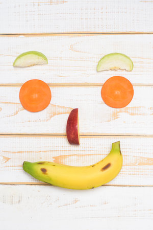face fruit on wooden white backgroundの写真素材
