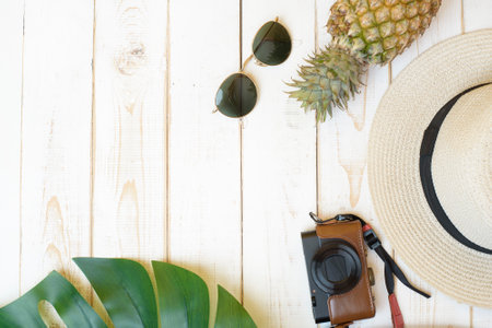 Summer accessories on white wooden  backgroundの写真素材
