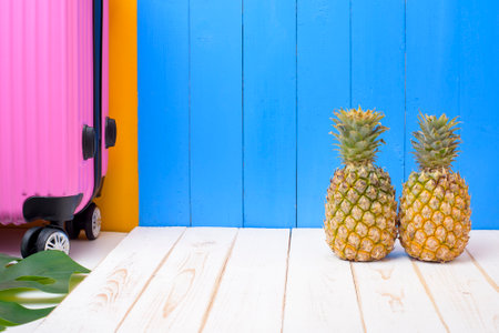 Pineapple on blue wooden backdropの写真素材