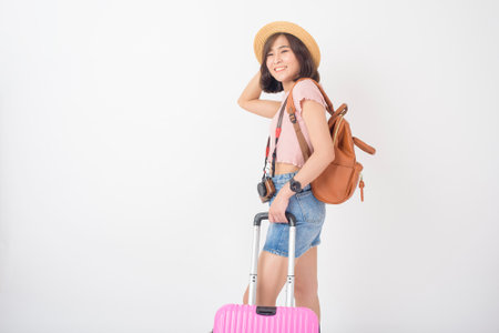Beautiful young asian tourist woman happy on white background studioの写真素材